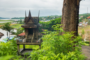 Fototapeta na wymiar Spirit houses made from wood in rural area of Thailand.
