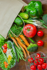 Healthy food in full paper bag of different products, vegetables. Top view. Food background