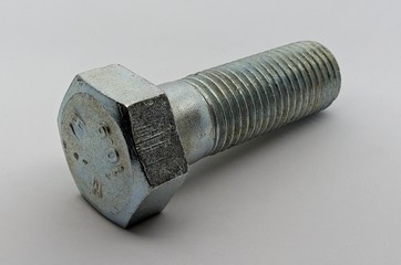Steel nut, bolt and washers on white background
