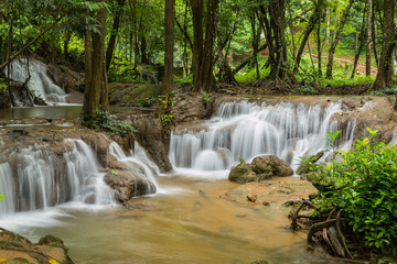 Obraz na płótnie Canvas Waterfall in autumn forest, Kanchanaburi, thailand.