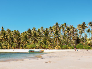 Paradise with white sandy beach, turquoise water and palm trees in Onok Island in Balabac Philippines 