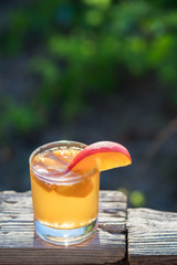 Homemade Fermented Raw Kombucha Tea Ready to Drink With peach. Summer probiotic healthy beverage in glass.