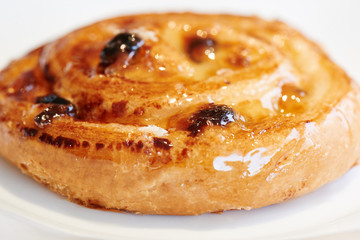 Appetizing cheesecake with cottage cheese on a white plate. Homemade pastry, bun with stuffing