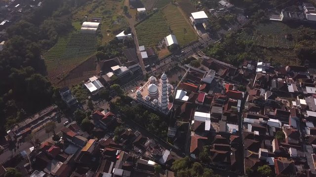 Above the roofs and mosque at Batu village, Java island, Indonesia 