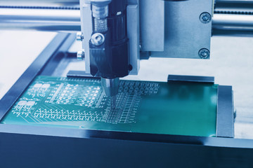 Automated manufacturing process for boards or microchips for electronics or computers.