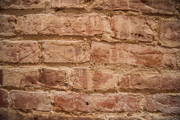 Old red brick wall, old texture of red stone blocks.