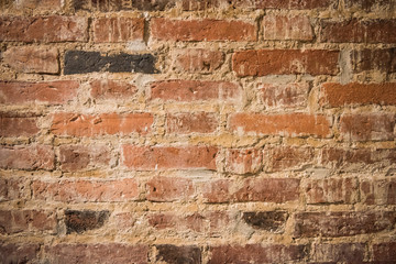 Old red brick wall, old texture of red stone blocks.