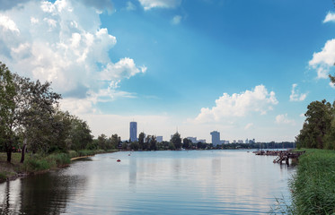 Naklejka premium River Danube and skyscrapers in distance in Vienna, Austria