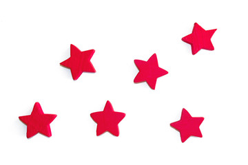 Small red wooden stars. New Year and Christmas decorations. Top view.