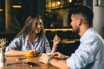 man and woman talking in cafeteria