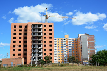 Fototapeta na wymiar Crane Construction. Colorful Cityscape with Crane