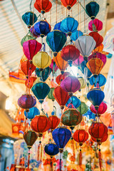 Fototapeta na wymiar Colorful tradition lantern at china town lantern market in saigon, Vietnam. Beautiful Chinese lanterns and Many kind of tradition lanterns are hanging on street market in mid autumn festival. 