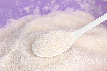white sugar with spoon white background