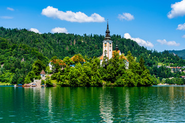 Landscape of Lake Bled and the church island in the middle of the lake with reflection on the water surface in Bled, Slovenia