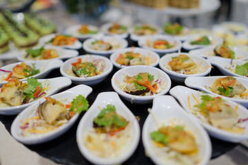 buffet food, catering food party at restaurant, mini canapes, snacks and appetizers