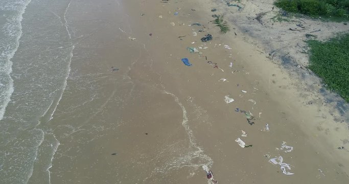 Trash, plastic, garbage, bottle... environmental pollution on the beach. Royalty high-quality free stock video footage of trash, plastic bottle on the beach. Waste that polluted the ocean environment