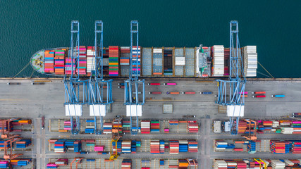 Aerial view cargo ship terminal, Unloading crane of cargo ship terminal, Aerial view industrial...