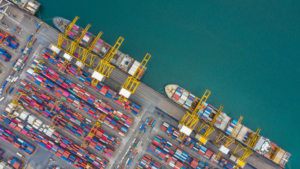 Aerial view cargo ship terminal, Unloading crane of cargo ship terminal, Aerial view industrial port with containers and container ship. - obrazy, fototapety, plakaty