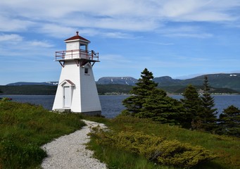 closeup of the red and white lighthouse in Woody Point, Gros Morne National Park Newfoundland and Labrador Canada