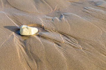 Fototapeta na wymiar Water ripples in the sand