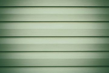 Fototapeta premium Light green wooden background in lines. Striped texture. Planks timber backdrop. Gray panel, wood surface. Grey painted boards. Oak fence. Copy space.