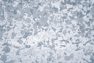 Plaster, whitewash cement wall in abstract style. Grunge grey concrete background. Old dirty texture. Modern art. Cement crack pattern. Light gray spots.