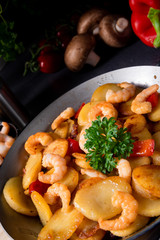 a delicious fried potato and shrimp pan