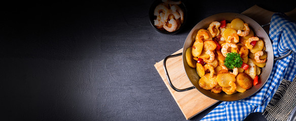 a delicious fried potato and shrimp pan
