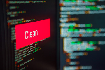 Programming language, Clean inscription on the background of computer code.