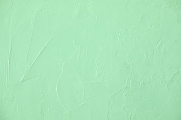 Trendy neo mint colored low contrast Concrete textured background with roughness and irregularities...