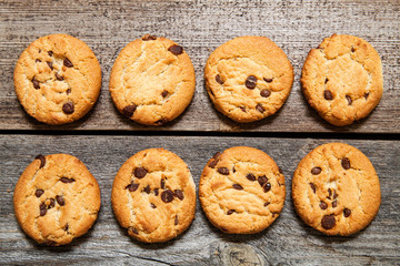 Chocolate chip cookies on wooden background. Sweet biscuits. Homemade pastry