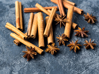 Cinnamon and anise on a dark stone table
