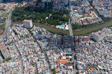 Top View of Building in a City - Aerial view Skyscrapers flying by drone of Ho Chi Mi City with development buildings, transportation, energy power 