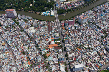 Top View of Building in a City - Aerial view Skyscrapers flying by drone of Ho Chi Mi City with development buildings, transportation, energy power 