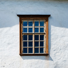Old wooden window of the house. White