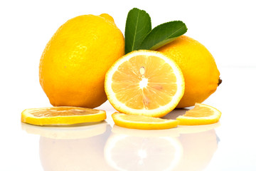 fresh lemon with leaves and ripe on white background
