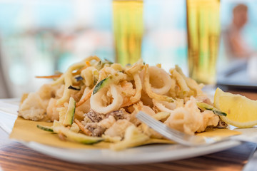 Fried mixed fish with ice-cold beer