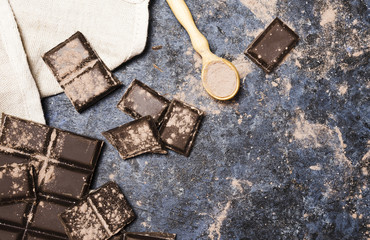 Top view chocolate tablets with cloth and spoon
