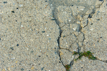 Closeup cracks in a concrete farm road in a rural area of Germany Europe