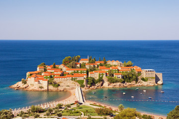 View of the Sveti Stefan Island on the Adriatic coast of Montenegro on a sunny summer day