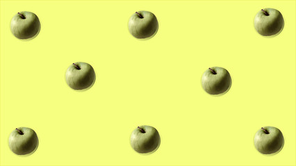 apples on yellow background