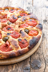 Focaccia typical of Bari Italy with tomatoes and olive