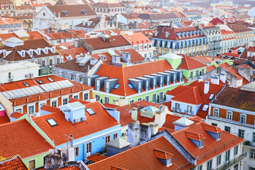 Naklejka premium Lisbon Portugal - Beautiful panoramic view of the red roofs of houses in antique historical district Alfama and the Tagus River and bridge from Sao Jorge Castle