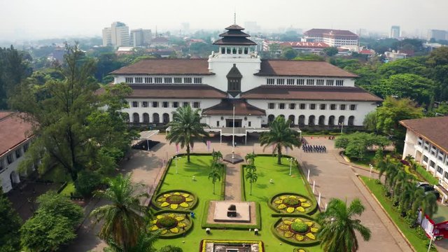 BANDUNG, Indonesia - July 18, 2019: Aerial scenery of Satay Building also known as governor office building in Bandung city, West Java, Indonesia. Shot in 4k resolution from a drone flying forwards