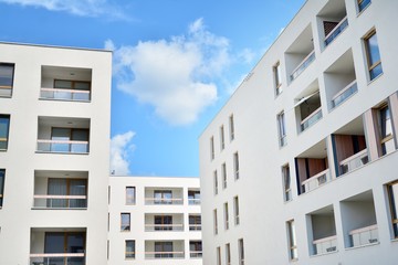 Fototapeta premium modern apartment building with blue sky and clouds
