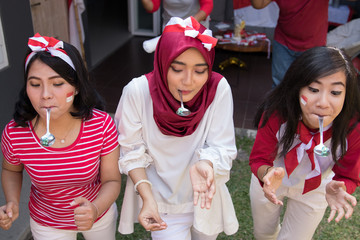 portrait of indonesian spoon marbles race during independence day