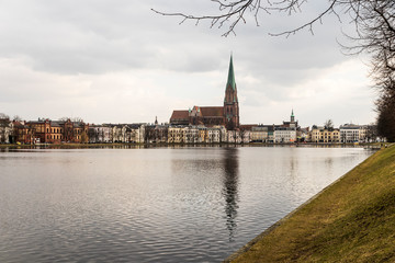 Obraz premium Schwerin, Germany. Views of Schwerin Cathedral (Schweriner Dom) in the Pfaffenteich, a pond lake in the middle of the city
