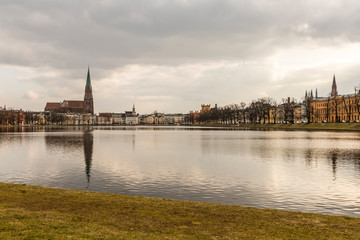 Fototapeta na wymiar Schwerin, Germany. Views of Schwerin Cathedral (Schweriner Dom) in the Pfaffenteich, a pond lake in the middle of the city