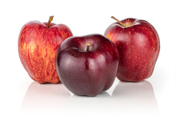 Group of three whole fresh apple red delicious isolated on white background
