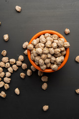 Chickpeas in the orange glass on the table